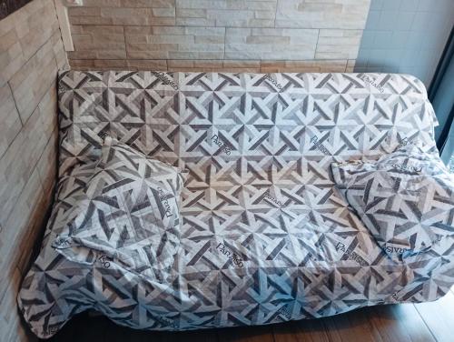 Cama o camas de una habitación en Meublés Le KANNISTEL