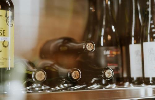 a bunch of bottles of wine on a shelf at Biohotel Rastbichlhof in Neustift im Stubaital