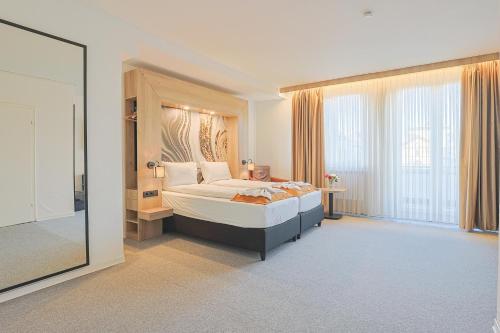 Postel nebo postele na pokoji v ubytování Liebig-Hotel
