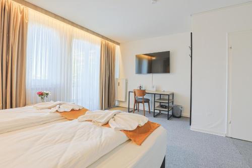 Postel nebo postele na pokoji v ubytování Liebig-Hotel