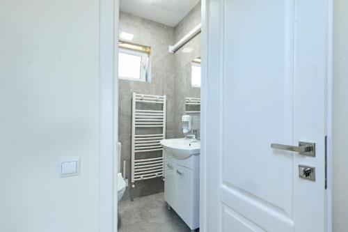 a bathroom with a sink and a toilet at OneLife Retreat 