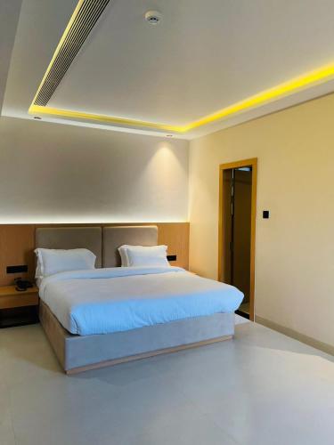 a bedroom with a large bed in a room at Nirvana Nest in Lucknow