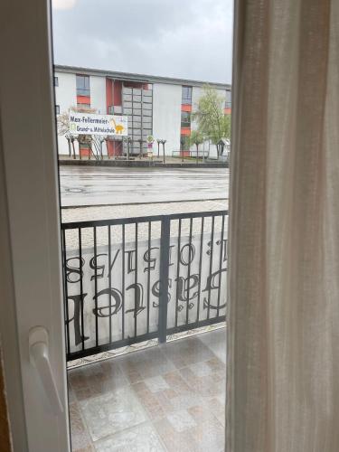 a view of a street from a balcony at ZV-Scholtz Gästehaus Neuötting Simbacher Straße 7 in Neuötting