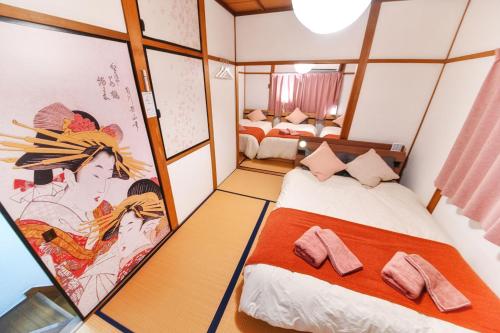 Postel nebo postele na pokoji v ubytování SAKURA-nagoya