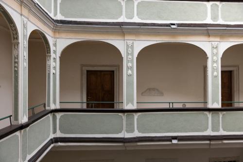 an empty building with several windows and a balcony at Casa Trentini 2 - Atemporary Art Apartments in Trento