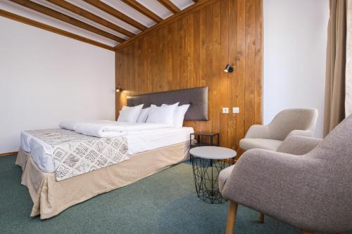 Postel nebo postele na pokoji v ubytování Hotel Razlog