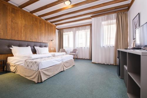 Postel nebo postele na pokoji v ubytování Hotel Razlog
