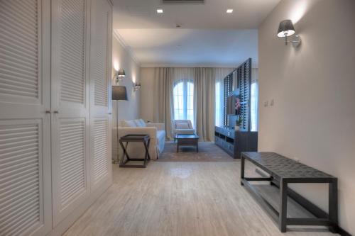 a living room with a couch and a table in a room at Hotel Moskva in Budva