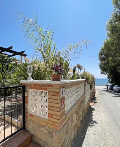 Cozy house next to a cove on the beach