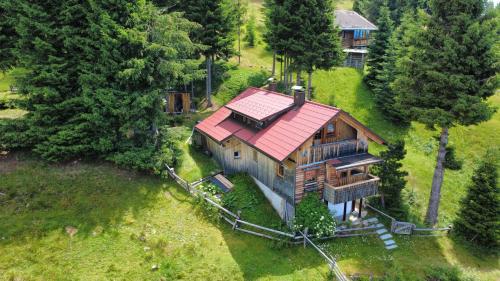 an overhead view of a house with a red roof at Almhütte Enzian in Greifenburg