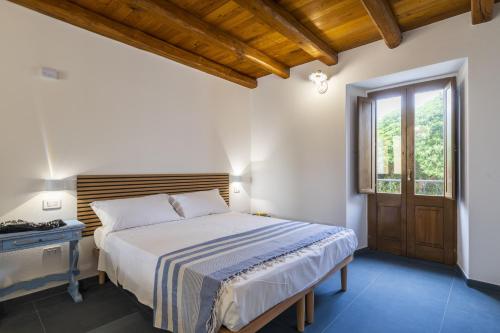 Ένα ή περισσότερα κρεβάτια σε δωμάτιο στο Casa Giacu Holiday Home
