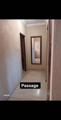 a hallway with a sign that reads passage in a room at Bhubhudla Guesthouse in Lobamba