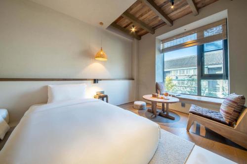 YUANLI HOTELにあるベッド