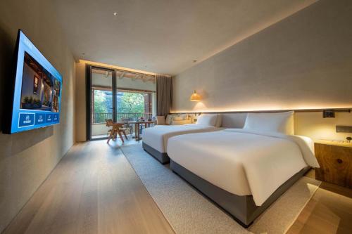 YUANLI HOTELにあるベッド