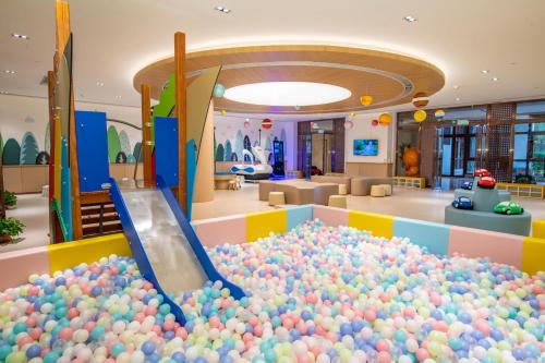 a large pile of balls in a ball pit at Sanya Haitang Bay Health Valley Resort Hotel in Sanya