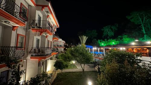 a view of a street at night with buildings at Casa De Levıssı Ölüdeniz in Oludeniz