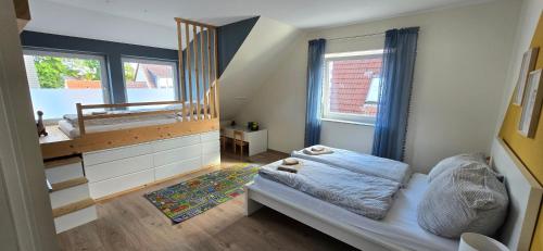 a small bedroom with a bed and a mirror at Komfort-Haus in Top-Lage in Osterholz-Scharmbeck