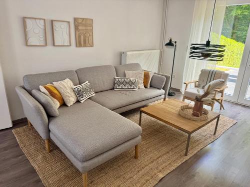 a living room with a couch and a chair at 'Casa Miliya' - Großzügiges Stadthaus mit Garten nähe Messe in Herford