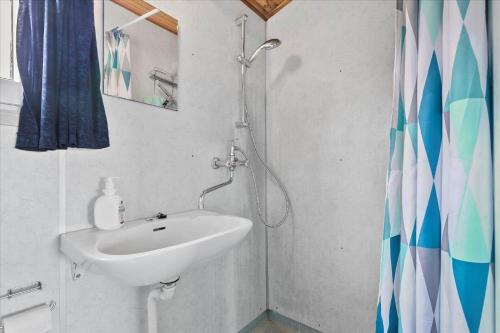 a bathroom with a sink and a shower at 6630-Allinge-Madselokke-5-Hus-45 in Allinge