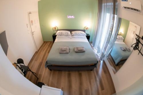 a view of a room with two beds in it at Altopiano Rooms Suite in Foggia