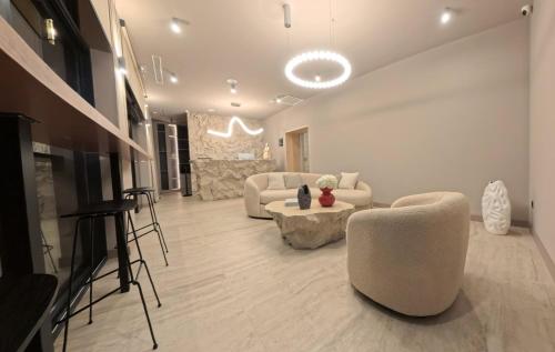 a living room with a couch and a table at Hotel Aquarius Dubrovnik in Dubrovnik