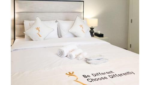 Ένα ή περισσότερα κρεβάτια σε δωμάτιο στο Comfort Cove 1BR in Al Maryah Island