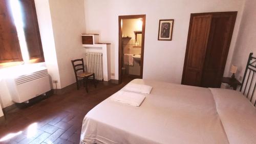 Postel nebo postele na pokoji v ubytování Borgo Bottaia