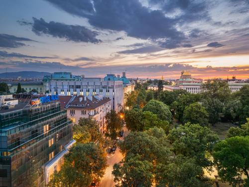an aerial view of a city at sunset at Crystal Palace Boutique Hotel in Sofia