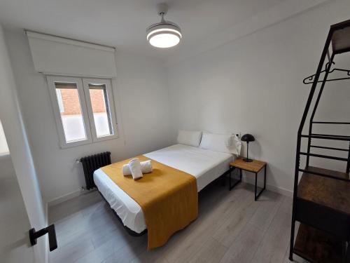 Ένα ή περισσότερα κρεβάτια σε δωμάτιο στο The Eight Unique Apartments