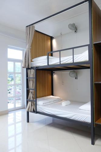 Katil atau katil-katil dalam bilik di RAW Hostel - Ha Giang Loop Tour & Motorbikes Rental