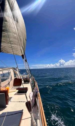 a sail boat in the ocean on the water at Catamaran CIELAZULA in Mahajanga
