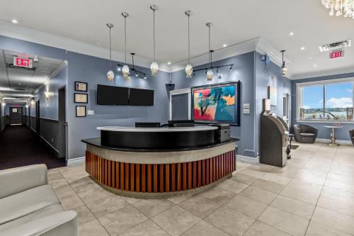 a lobby with a bar with a tv on the wall at Bayview Inn in Bay Roberts