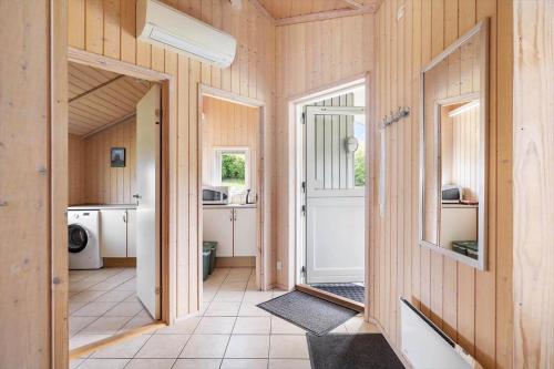 a hallway of a house with a door and a kitchen at 6840-Allinge-Gjedelokken-23 in Allinge
