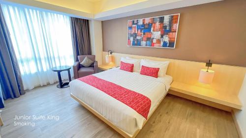 Una cama o camas en una habitación de Grand Zuri BSD City