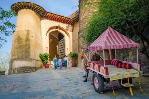 a cart parked in front of a building at Neemrana Fort-Palace in Neemrana