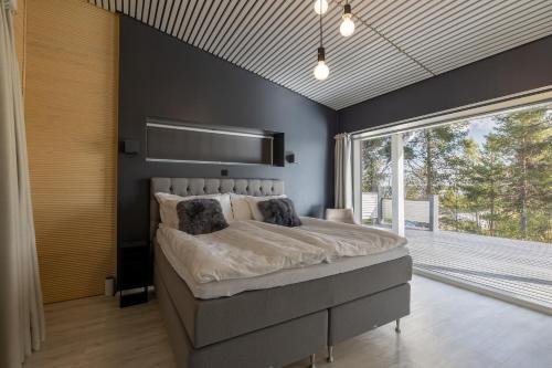 Ένα ή περισσότερα κρεβάτια σε δωμάτιο στο Villa Witkala Ylläs