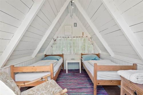 a room with two beds in a attic at HA137-Hals-Sondergade-17 in Hals