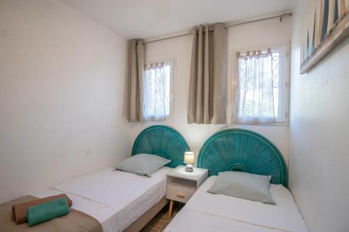 Postel nebo postele na pokoji v ubytování Maison Porto Vecchio 6p