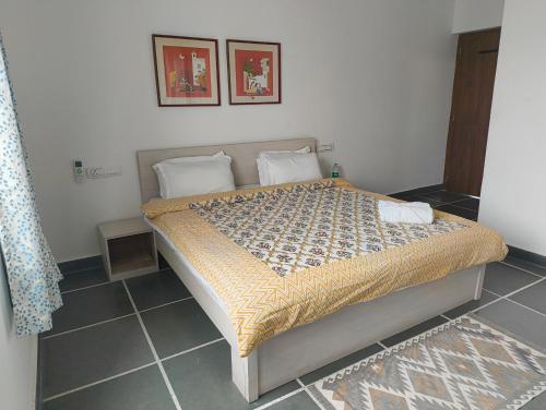 a bedroom with a bed in a room at Rising Shemesh Home Stay in Udaipur