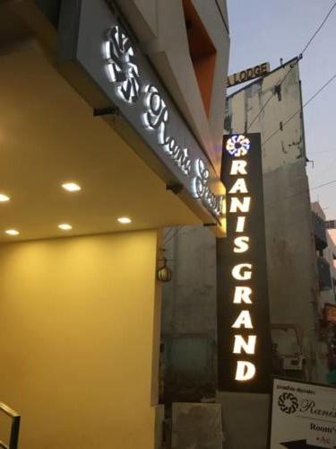 a sign for a restaurant on the side of a building at Ranis Grand in Coimbatore