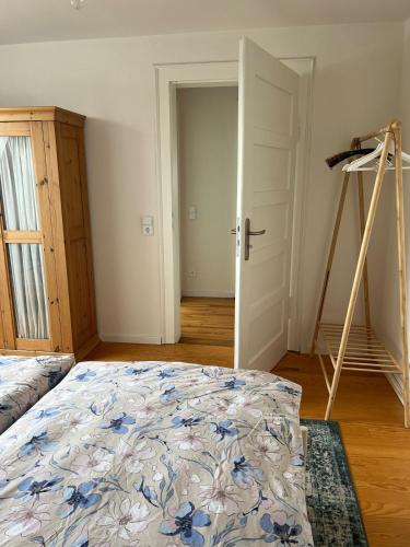 a bedroom with a bed and a ladder in it at Elegantes Apartment in Villa in Ottobeuren