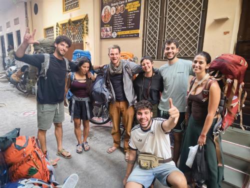 a group of people posing for a picture on a street at Rising Shemesh Home Stay in Udaipur