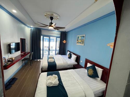 Katil atau katil-katil dalam bilik di Sadakham Green Garden Hotel
