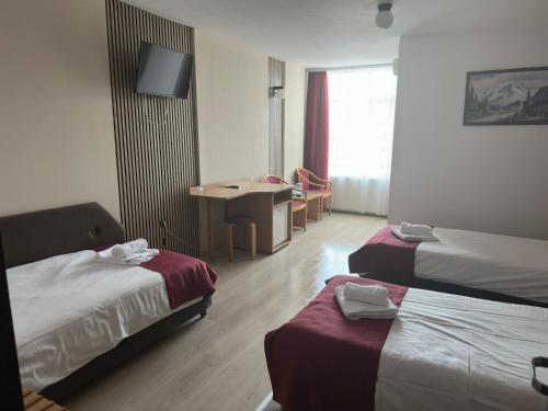 Katil atau katil-katil dalam bilik di Hotel Apollo Central