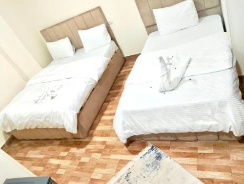 Ένα ή περισσότερα κρεβάτια σε δωμάτιο στο Star Pyramids Sky View Inn