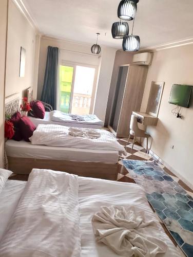 Ένα ή περισσότερα κρεβάτια σε δωμάτιο στο Star Pyramids Sky View Inn
