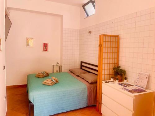 Postel nebo postele na pokoji v ubytování Il Giardino di Rosa & Elino