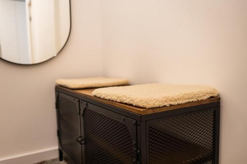 a mirror sitting on top of a dresser in a room at SongInn Lake Apartment in Zarasai