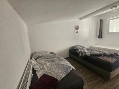 Un ou plusieurs lits dans un hébergement de l'établissement Welcome to Ndé-flat in Abstatt
