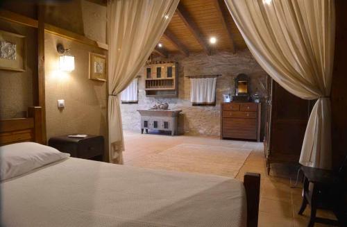 a bedroom with a bed and a sink in a room at Azenha São Rafael in Ribeirão